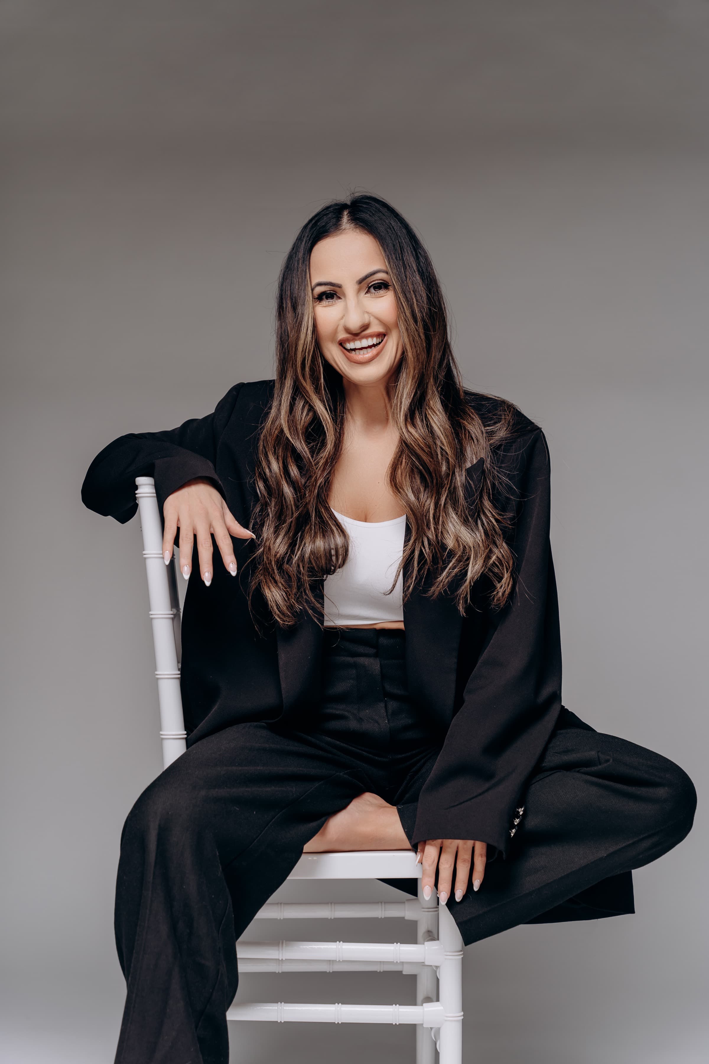 Hevi Serdar seated, laughing