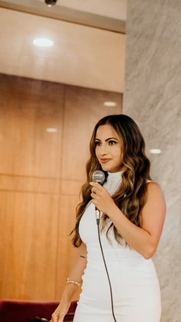 Hevi Serdar speaking in white