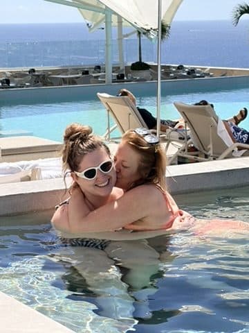 An embrace by the water