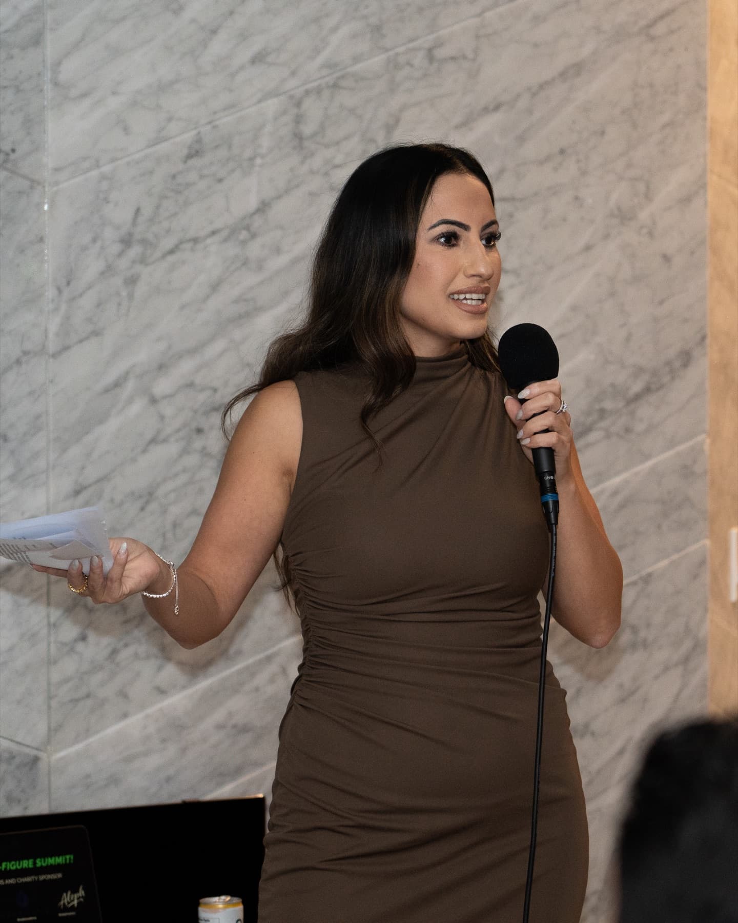Hevi Serdar speaking to a summit audience