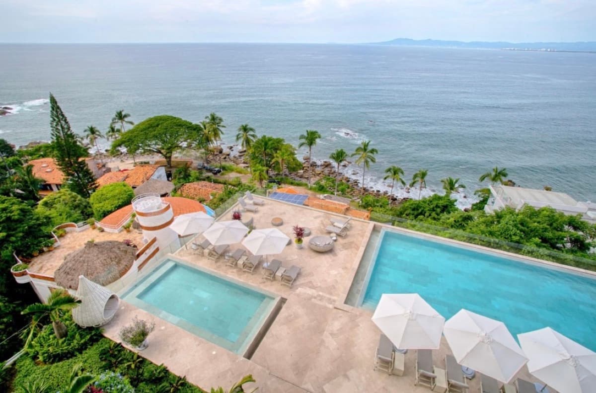 The villa pools above the coastline, from the air