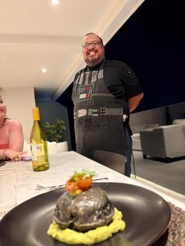 The private chef with a plated dish at the villa
